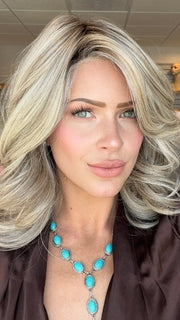 Madeline is wearing FLIP THE SCRIPT by RAQUEL WELCH in RL17/23SS ICED LATTE MACCHIATO | Honey Blonde shaded with Cool Blonde