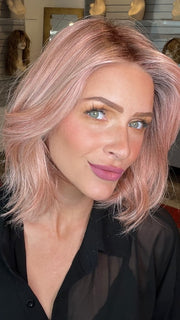 Madeline wearing MIRA by AMORE in WATERMELON-R | Rich Pastel Pink Base with Subtle Soft Reddish Tone and Soft Dark Brown Roots 