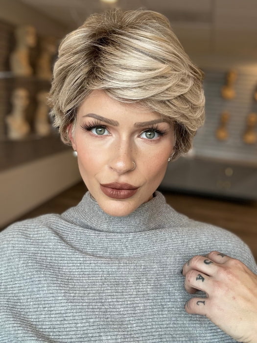 Madeline is wearing ANNE by JON RENAU in FS17/101S18 PALM SPRINGS BLONDE | Light Ash Blonde with Pure White Natural Violet Bold Highlights, Shaded with Dark Natural Ash Blonde