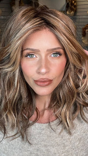 Madeline wearing BEACH WAVE MAGIC by  TRESSALLURE in 17/23/R8 | Beige Blonde and Auburn Blended with Medium Brown Roots