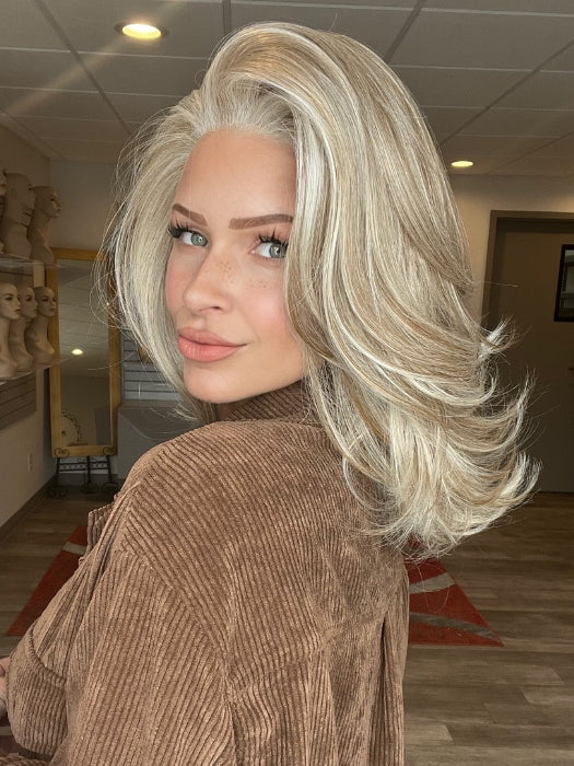 Madeline is wearing SHOWRUNNER by RAQUEL WELCH in RL19/23 BISCUIT | Light Ash Blonde Evenly Blended with Cool Platinum Blonde