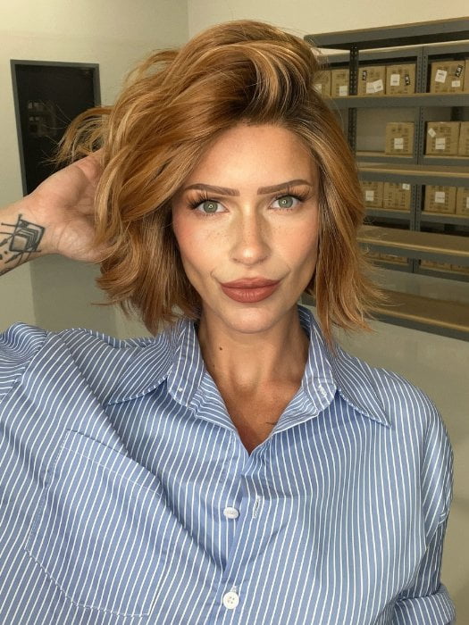 Madeline wearing AUSTEN by BELLETRESS in MIXED BERRY R | A bold, berry-inspired red with deep auburn tones and soft rooting for a natural regrowth effect.
