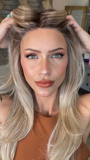 Madeline wearing SPEARS by BELLETRESS in MILKSHAKE BLONDE R | A mixture of Light Sandy Brown, Highlighted with Light Ash Blonde with a Hint of Light Platinum Blonde with a Medium Root Color