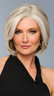 Model is wearing TAILORED ALLURE in color L51/61 ICED GRANITA | Lightest Grey Progresses to a Deep Grey at the Nape
