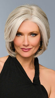 Model is wearing TAILORED ALLURE in color L51/61 ICED GRANITA | Lightest Grey Progresses to a Deep Grey at the Nape