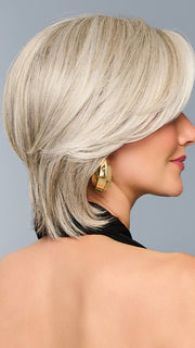Model is wearing TAILORED ALLURE in color L51/61 ICED GRANITA | Lightest Grey Progresses to a Deep Grey at the Nape
