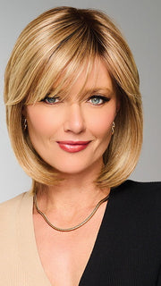 Model is wearing TIMELESS CHARM by RAQUEL WELCH in color  RL14/22SS SHADED WHEAT | Dark Blonde Evenly Blended with Platinum Blonde with Dark Roots