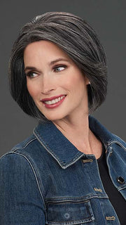 Model is wearing IGNITE HH in color 1B/60 PEPPERCORN | Soft Black blended with Pure White Grey Peppered Throughout