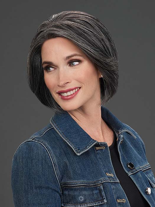 Model is wearing IGNITE HH in color 1B/60 PEPPERCORN | Soft Black blended with Pure White Grey Peppered Throughout