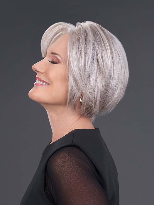 Model is wearing IGNITE HH in color 39/51/60 MIST | Pure White front with Light Natural Ash Brown with 75% Light Grey, graduating to Light Grey with 30% Dark Brown