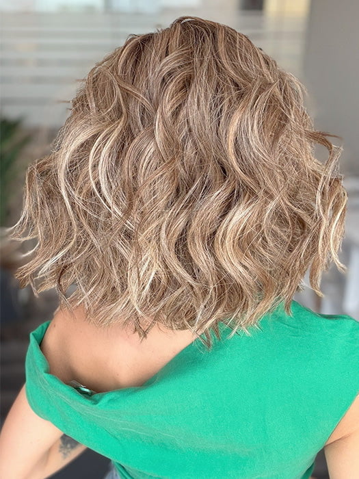 Model is wearing ROMANTIC RENAISSANCE by RAQUEL WELCH in color SS12/22 SHADED CAPPUCCINO | Light Golden Brown Evenly Blended with Cool Platinum Blonde Highlights and Dark Roots