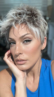 Model is wearing CHAT by ELLEN WILLE in color PEARL ROOTED | Pearl Platinum with Medium Ash Blonde and Lightest Brown with Grey Blend and Shaded Roots