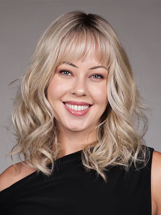 Model is wearing SIMONE in color BUTTERBEER R | Dark Brown Base and Root that transitions smoothly into a buttery blonde, infused with creamy honey and toffee tones