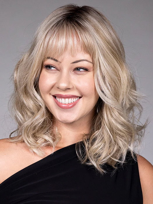 Model is wearing SIMONE in color BUTTERBEER R | Dark Brown Base and Root that transitions smoothly into a buttery blonde, infused with creamy honey and toffee tones