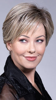 Model is wearing SPENCER by BELLETRESS in color SPARKLING CHAMPAGNE BLONDE-R 8/16/21+8 | A radiant blend of champagne blonde with soft golden and beige tones, grounded by natural-looking roots in ash brown and dark blonde. 