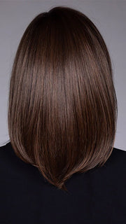 Model is wearing STREISAND in SOFT AMBER BROWN R | A warm rooted, amber-toned shade blending golden and red hues over a medium brown base.