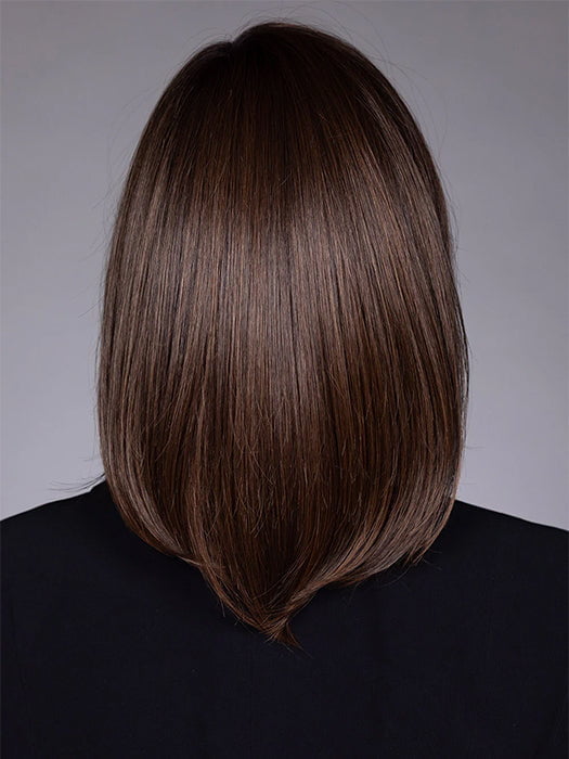 Model is wearing STREISAND in SOFT AMBER BROWN R | A warm rooted, amber-toned shade blending golden and red hues over a medium brown base.