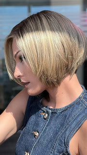 Model is wearing SHELBY by JON RENAU in color 24BT18S8 SHADED MOCHA | Medium Natural Ash Blonde & Light Natural Gold Blonde Blend, Shaded with Medium Brown