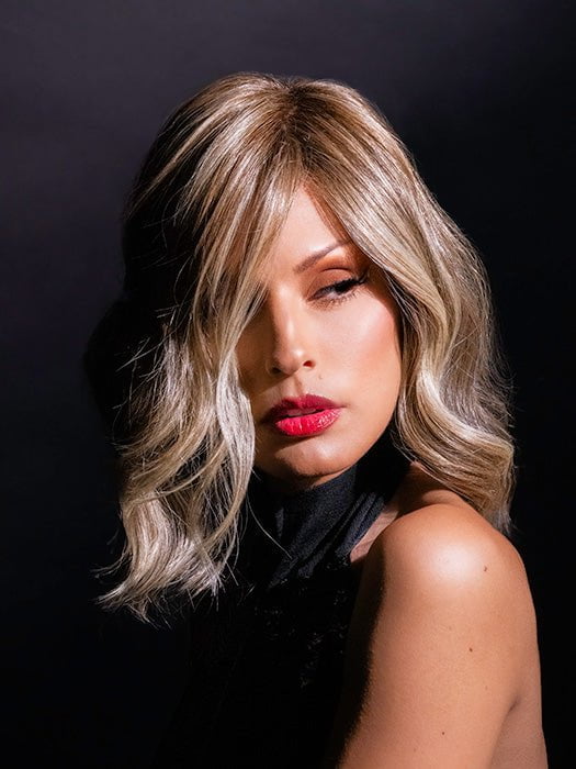 Roxie wearing SIMMER by RAQUEL WELCH in RL12/22SS SHADED CAPPUCCINO | Light Golden Brown Evenly Blended with Cool Platinum Blonde Highlights with Dark Roots