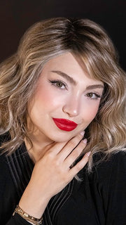 Maha wearing SIMMER ELITE by RAQUEL WELCH in RL12/22SS SHADED CAPPUCCINO | Light Golden Brown Evenly Blended with Cool Platinum Blonde Highlights with Dark Roots