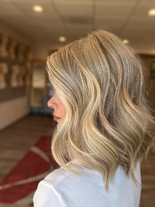 Madeline is wearing SIMMER ELITE by RAQUEL WELCH  in RL16/88 PALE GOLDEN HONEY | Dark Natural Blonde Evenly Blended with Pale Golden Blonde