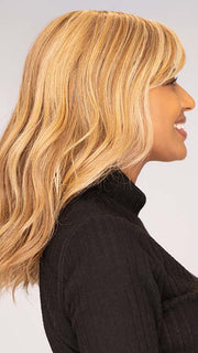 Sophia wearing Beach Wave Magic by TressAllure in color 14/26/R10 | Red Blonde with Gold Blonde highlights and Light Brown roots