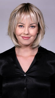 Model is wearing TRIBECA By BELLETRESS in CRUSHED-ALMOND-BLONDE-R | A Soft Neutral Light Blonde with a Light and Medium Blended Root Color