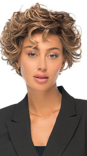 Model is wearing TWISTED PIXIE in color EL17/23/R8 | Pale Auburn Beige Blonde Blend, Rooted Medium Brown, Highlighted Light Blonde with face framimg highlights