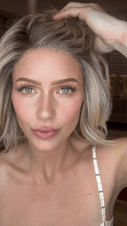MADELINE is wearing RAW SUGAR BLONDE | A Neutral Light Blonde, Honey Blonde, Pale Gold Blonde, with a base of Light Brown Low Lights featuring a Medium Root Color