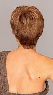 Roxie is wearing the WINNER by RAQUEL WELCH in color R3025S+ GLAZED CINNAMON | Medium Auburn with Ginger Blonde Highlights on Top