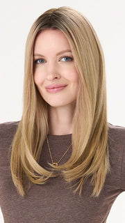 Model is wearing BARELY THERE STRAIGHT TOPPER in color PROSECCO | BROWN ROOTS WITH GOLDISH BLONDE HIGHLIGHTS