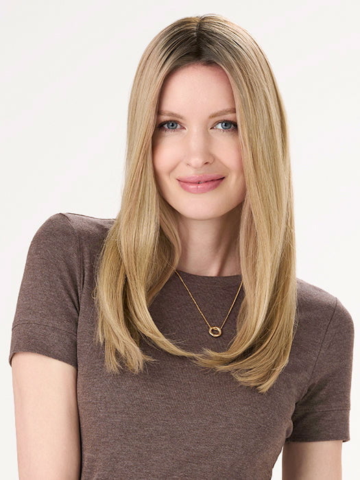 Model is wearing BARELY THERE STRAIGHT TOPPER in color PROSECCO | BROWN ROOTS WITH GOLDISH BLONDE HIGHLIGHTS