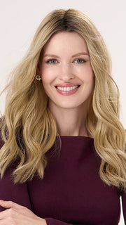 Model is wearing BARELY THERE WAVY 16" in color PROSECCO | BROWN ROOTS WITH GOLDISH BLONDE HIGHLIGHTS