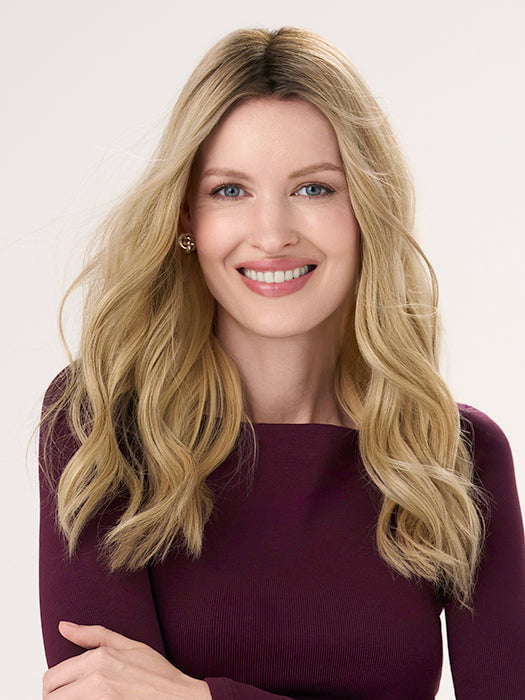Model is wearing BARELY THERE WAVY 16" in color PROSECCO | BROWN ROOTS WITH GOLDISH BLONDE HIGHLIGHTS