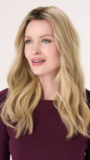 Model is wearing BARELY THERE WAVY 16" in color PROSECCO | BROWN ROOTS WITH GOLDISH BLONDE HIGHLIGHTS