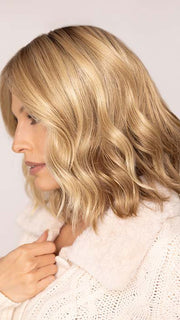 Roxie wearing CHARLOTTE in color SPARKLING CHAMPAGNE | Medium Brown roots with overall Strawberry Blonde base and soft Golden Blonde highlights