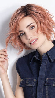 Model is in ROSE BLUSH ROOTED | Light copper, Peach, and Soft Rose Gold tones with subtle Golden Undertones and Shaded Roots