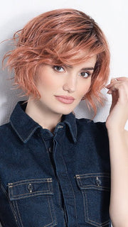 Model is in ROSE BLUSH ROOTED | Light copper, Peach, and Soft Rose Gold tones with subtle Golden Undertones and Shaded Roots