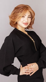 Maha is wearing CROWD PLEASER by RAQUEL WELCH in color RL31/29 FIEREY COPPER | Medium Light Auburn Evenly Blended with Ginger Blonde