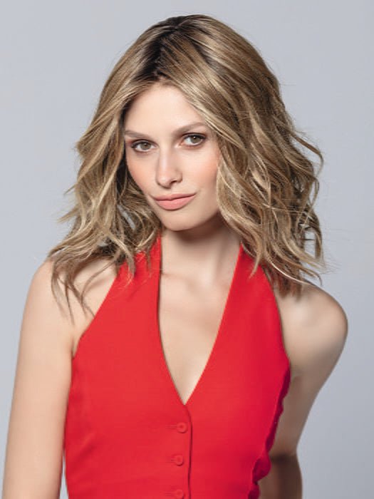 Model is wearing DEMI MONO by ELLEN WILLE in color BERNSTEIN ROOTED | Light Brown base with subtle Light Honey Blonde and Light Butterscotch Blonde highlights and Dark 