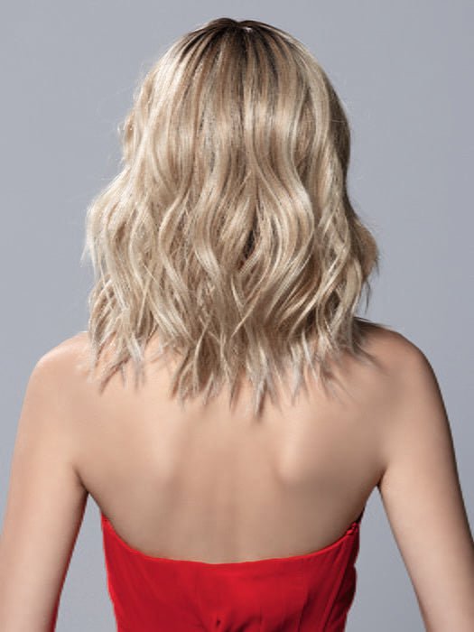 Model is wearing DEMI MONO by ELLEN WILLE in color PEARL BLONDE ROOTED | Pearl Platinum and Lightest Ash Blonde with Medium Ash Blonde Blend and Shaded Roots