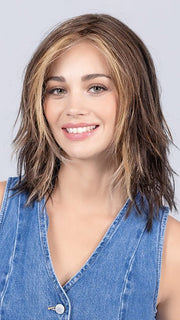 Model is wearing COFFEE BROWN LIGHTED | Dark Brown and Medium Warm Brown with Medium Blonde Blends with Highlights Throughout and Concentrated in the Front