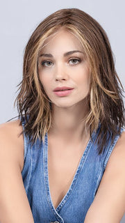 Model is wearing COFFEE BROWN LIGHTED | Dark Brown and Medium Warm Brown with Medium Blonde Blends with Highlights Throughout and Concentrated in the Front