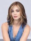 Model is wearing COFFEE BROWN LIGHTED | Dark Brown and Medium Warm Brown with Medium Blonde Blends with Highlights Throughout and Concentrated in the Front