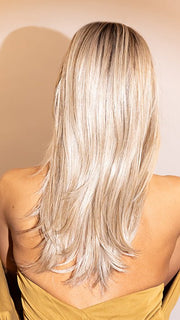 Jenna wearing MESMERIZED by RAQUEL WELCH in RL19/23SS SHADED BISCUIT | Light Ash Blonde Evenly Blended with Cool Platinum Blonde with Dark Roots