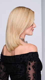Model is wearing MIDNIGHT IN PARIS by RAQUEL WELCH in color RH14/88SS SHADED GOLDEN WHEAT | Dark Blonde Evenly Blended with Pale Blonde Highlights that extend from dark roots to ends