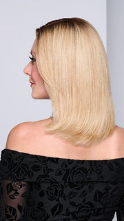 Model is wearing MIDNIGHT IN PARIS by RAQUEL WELCH in color RH14/88SS SHADED GOLDEN WHEAT | Dark Blonde Evenly Blended with Pale Blonde Highlights that extend from dark roots to ends