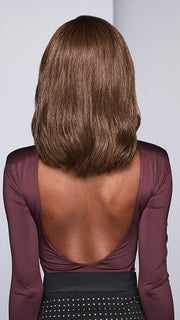 Model is wearing SORRENTO SURPRISE by RAQUEL WELCH in color RL8/12SS SHADED MOCHA | Medium Brown with Dark Blonde highlights from roots to ends