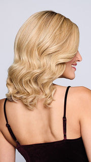 Model is wearing SORRENTO SURPRISE by RAQUEL WELCH in color RH14/25SS SHADED HONEY GINGER | Dark Blonde Evenly Blended with Medium Golden Blonde with dark roots