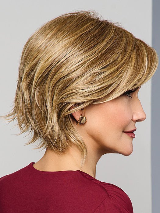 Model is wearing MAIN CHARACTER by RAQUEL WELCH in RL 13/88 GOLDEN PECAN | Neutral Medium Blonde With Pale Honey Blonde Highlight